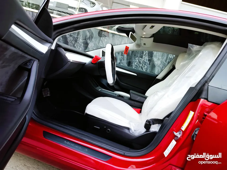 تيسلا 2022 model 3 فحص كامل 4 جــيـــد بدون ملاحظات غرفة جلد ابيض لون مميز بحالة الوكالة بسعر لقطة