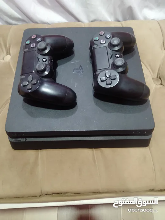 playstation 4 slim with 2 controllers