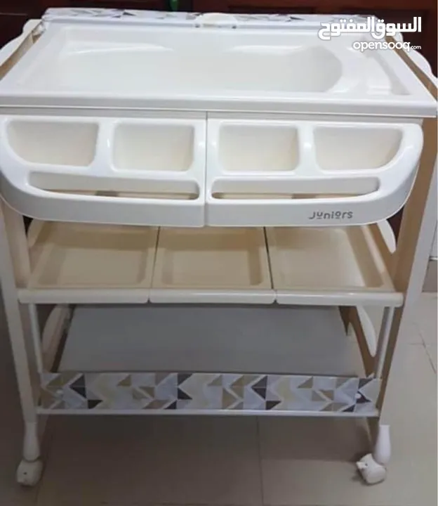 Baby bathing bed with changing mat and storage
