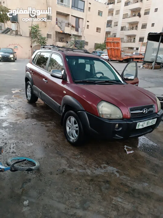 جيب هونداي توسان موديل 2007 ماطور 2000 لون خمري كام لا ينقصه شيئ