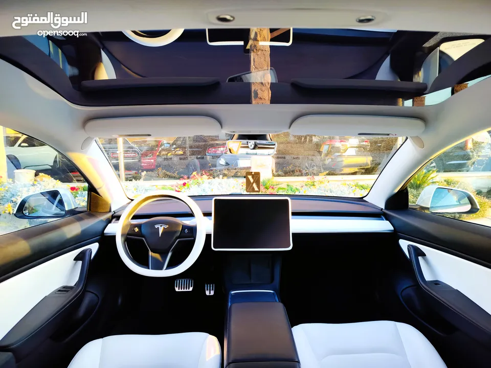 تيسلا 2021 model 3 فحص كامل 4 جـيـد فرش ابيض جنط 19بحالة الوكالة لون مميز للبيع بسعر لقطة ومحروووق