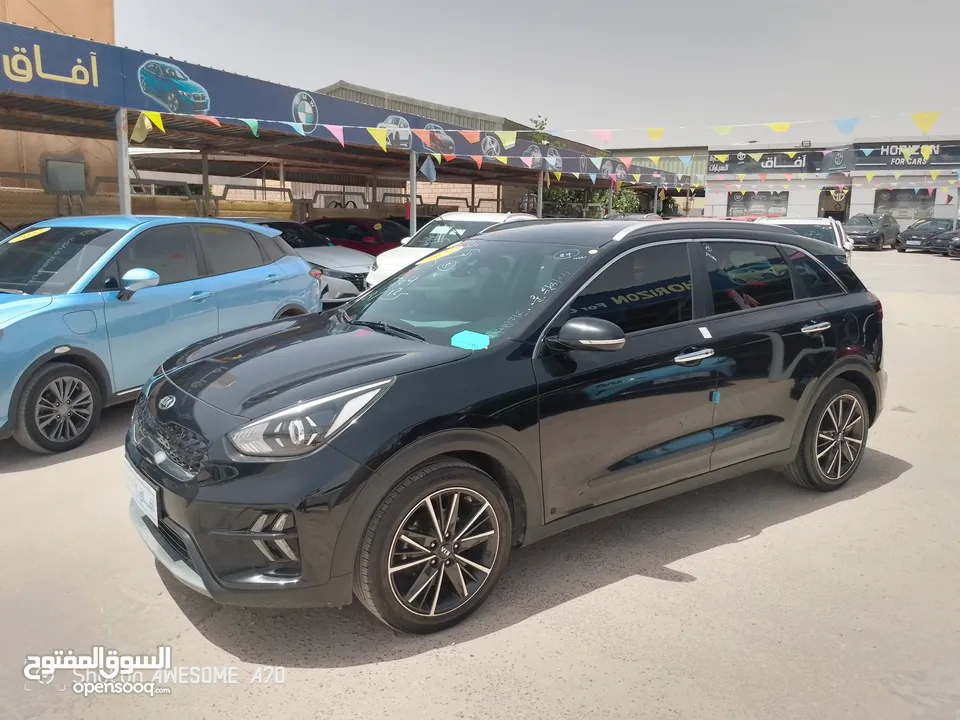 كيا نيرو هايبرد 2021 فحص 7جيد لون اسود مميزه للبيع مجمرك أو بدون جمرك للإعفاءات من المستورد مباشره