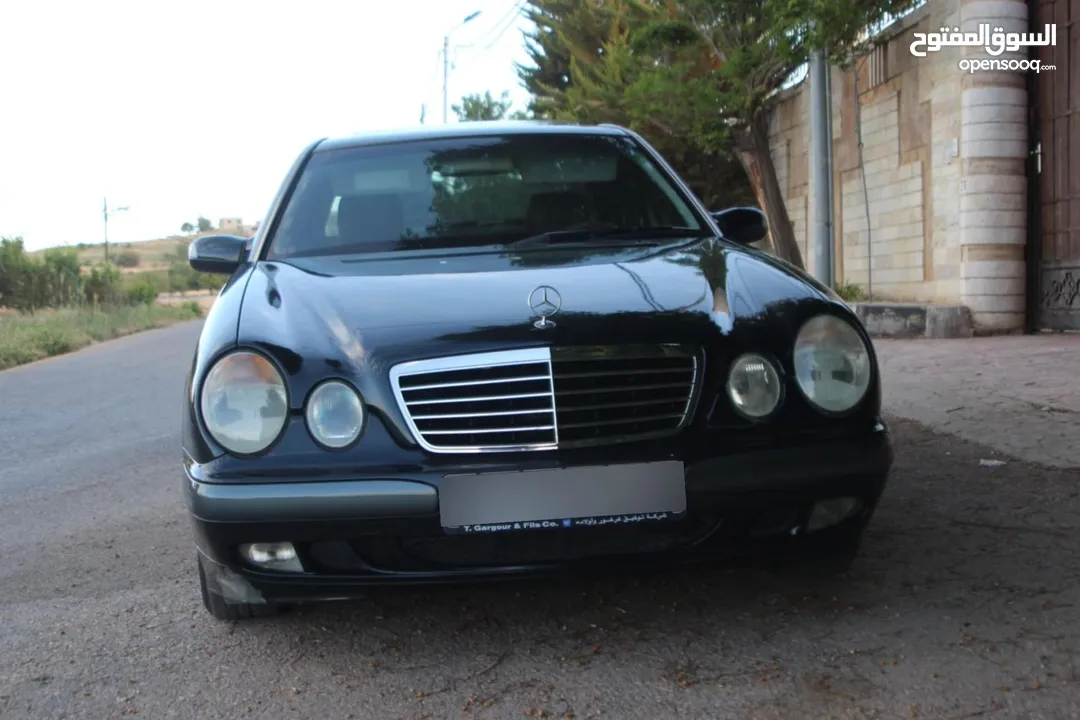 E200. 2002  قرش ونص 2002  رقم الهاتف بالوصف