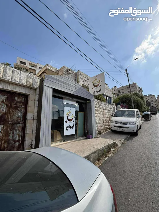 دونم ارض للبيع وعليه بناء في رفيديا مقابل جامعة النجاح