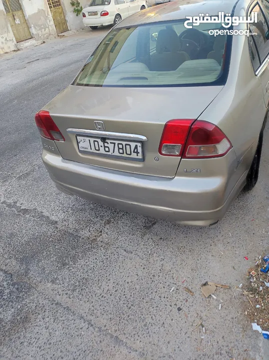 هوندا سيفيك لون ذهبي موديل 2003 جير عادي  إقتصادية جدا تقطع بالتنكة 280 كيلو بور ستيرنح سنتر لوك