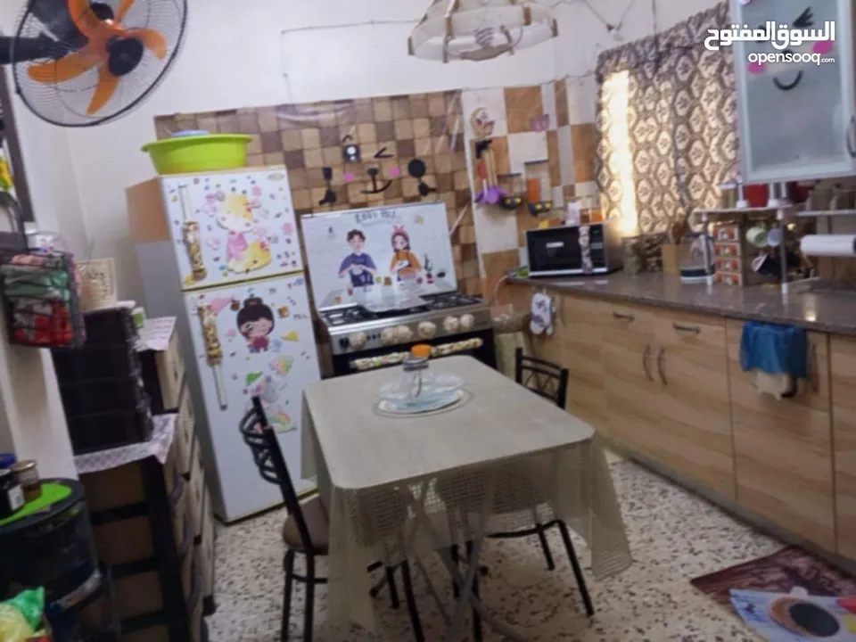 عمارة وسط السوق التجاري بين شارع السعادة وشارع الملك عبدالله