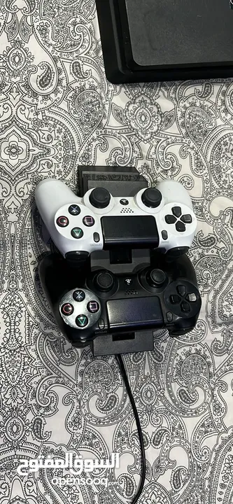 Ps4 with two controllers and 4 games including overwatxh ultimate edition