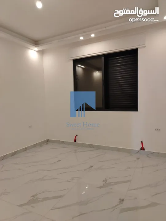 شقة أرضية فاخرة للبيع في خلدا - قرب إشارة البنك العربي 145م مع حديقة وترسات 120م لم تسكن
