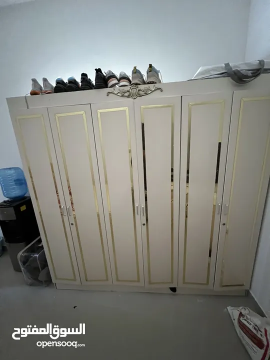 Wardrobe, Bed, water dispenser and standing mirror