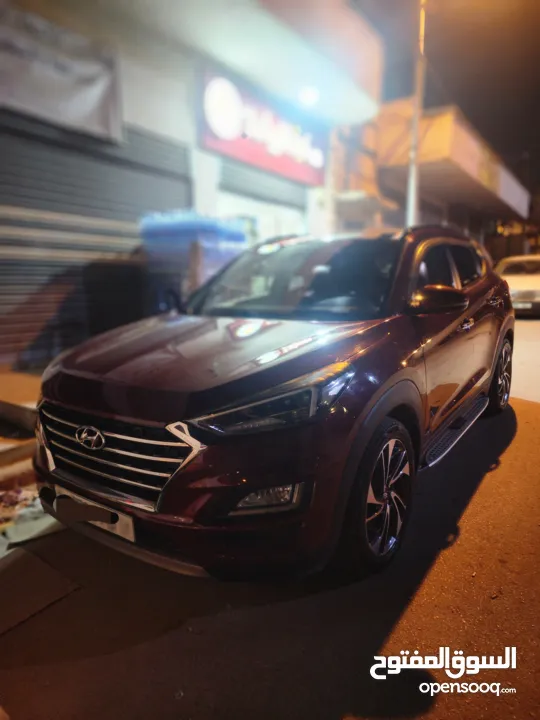 هونداي توسان 2019 فل إضافات جنط مغنيسيوم كراسي جلد لون خمري كهرباء فتحة سقف بانوراما تدفئة وتبريد