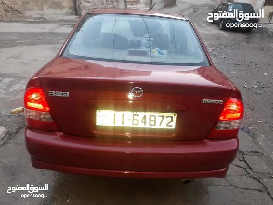 مازدا 323 موديل ال2003 باعتبار فحص كامل