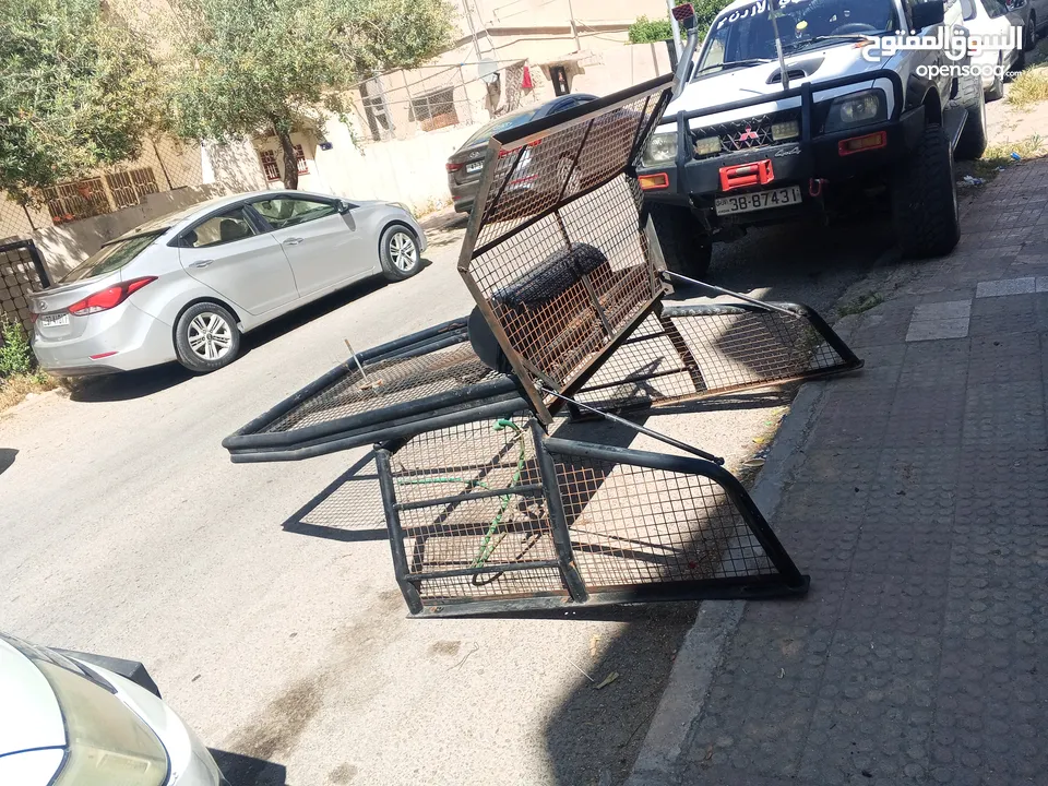 رول بار مع سلة وشبك (غرفة شبك) لبك اب ميتسوبيشي من موديل 2000 ولغاية 2006 بحالة الوكاله