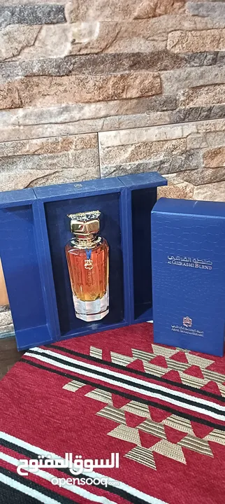 عطر خلطه القرشي جديد90مل للرجال والنساء  مع ستاند خشب لون ازرق