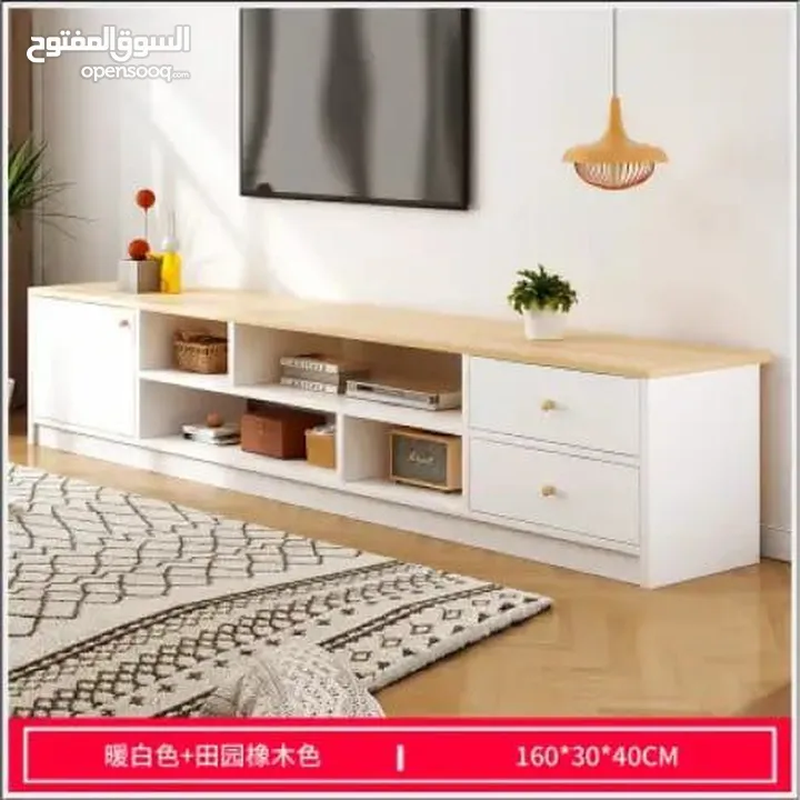 طاولة تلفزيون بلون أبيض وخشبي بتخطف الأنظار! المقاس 160*30*40 سم تصميم مودرن وعصري