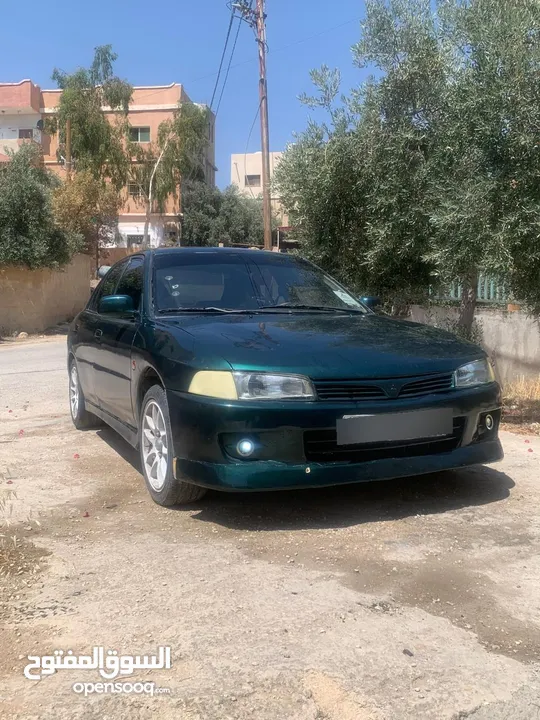 متسوبيشي لانسر 1997 موجوده في جرش في مجال للتفاوض بشي بسيط