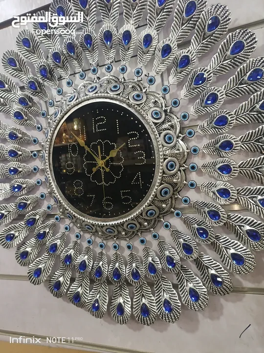 ساعة طاووس تحفه  معدنيه  ضخمه