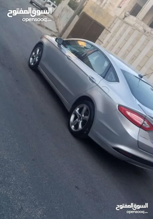 فورد فيوجن 2014 هايبرد كلين فحص كامل لون سلفر بحالة الوكالة