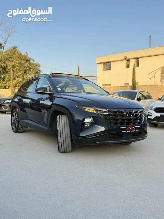 هونداي توسان ترخيص 2022 محرك 1600 هايبرد plug in/يقطع على الشحنه 65 كيلو متر  271 حصان