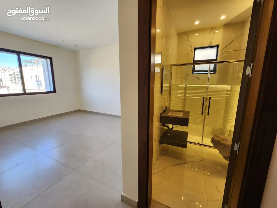 شقة طابقية فاخرة للبيع في عبدون ref : 14384