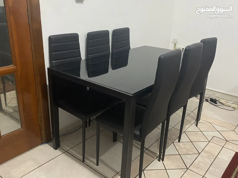 Black glass dining table with 6 chairs