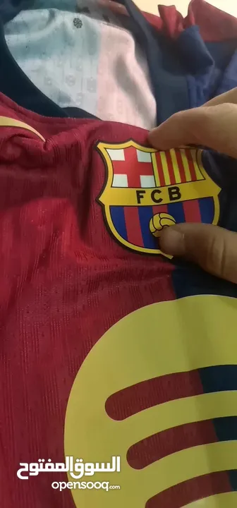 تيشيرت برشلونة نسخة لاعبين  كوبي ون مع شعار دوري الابطال موسم24/25