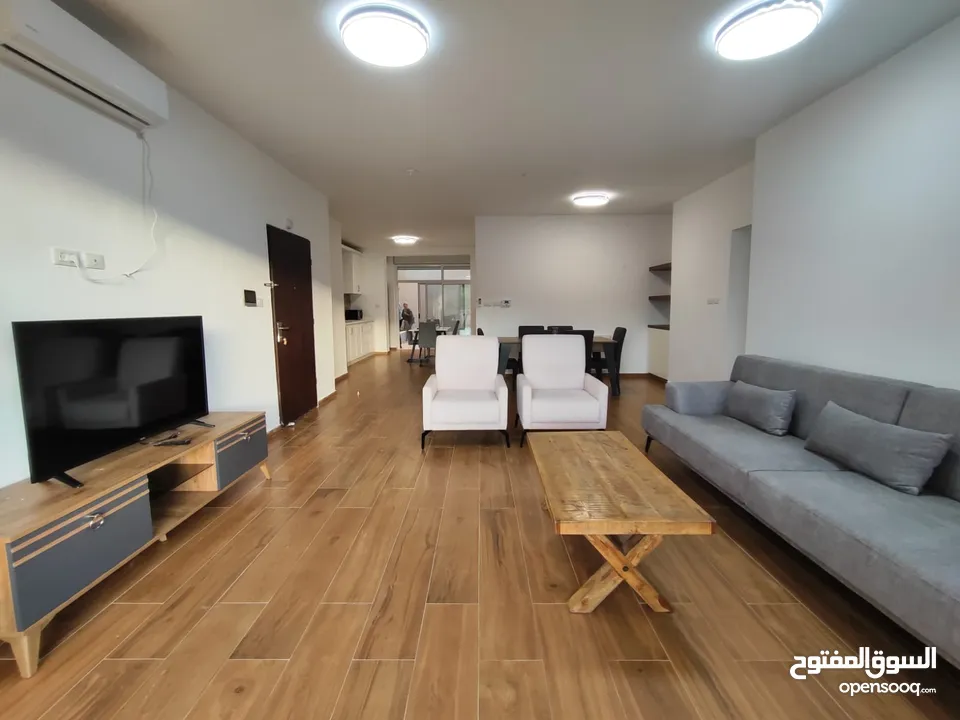 شقة جديدة مفروشة مع حديقة خاصة للإيجار – عين منجد  شارع إسكان المهندسين