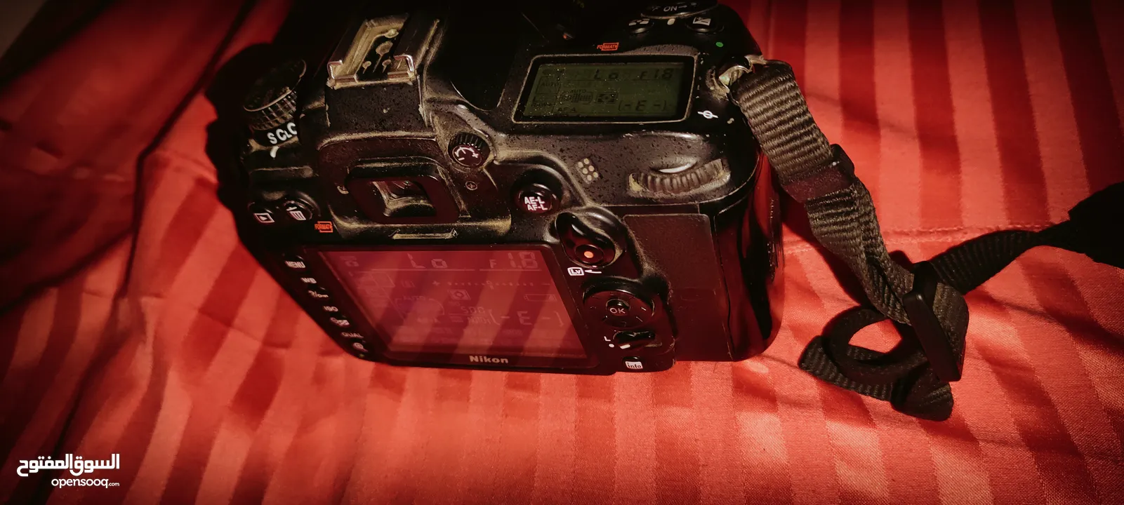 Nikon D7000 with 50mm 1.8F lens مع البطارية والشاحن وعدسه شبه جديده
