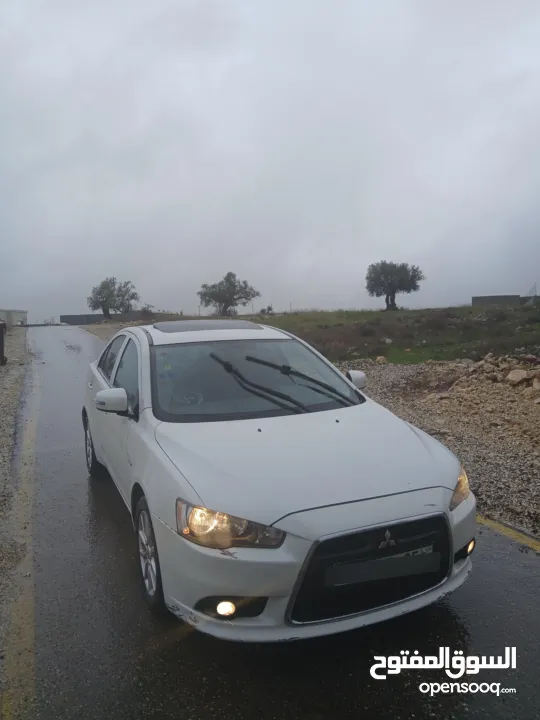 ميتسوبيشي لانسر. 2015 اصل برايفت   رخصة وتامين  ماطور 1600 اتومات  شامل  فتحة   اماكنية لبيع نص بنص