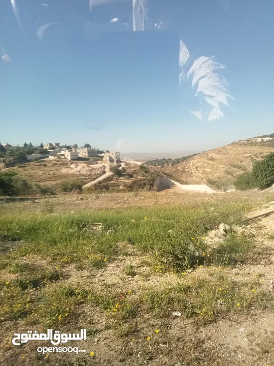 ارض سكنيه مقابل طريق ال100للببع بسعر مغري