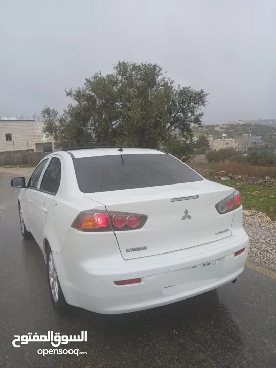 ميتسوبيشي لانسر. 2015 اصل برايفت   رخصة وتامين  ماطور 1600 اتومات  شامل  فتحة   اماكنية لبيع نص بنص