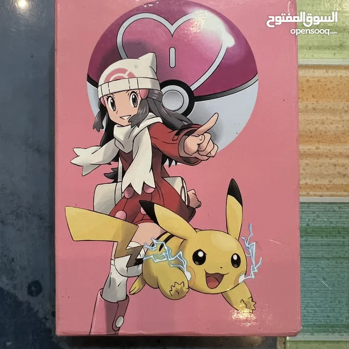 كروت بوكيمون والبومات (Pokemon cards and binders)