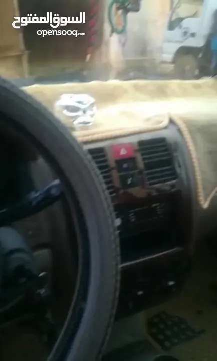 هيونداي كلك لونها ابيض 2003
