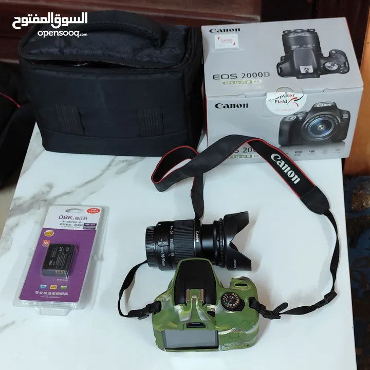 كاميرا كانون D2000 مستعملة شهر شبه جديده مع كرتونتها شتر اقل من1000
