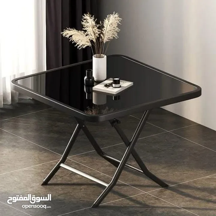 طاولة و 4 كراسي هيكل ستيل قوي ومتين مع سطح زجاجي ، قابل للطي لتوفير المساحه