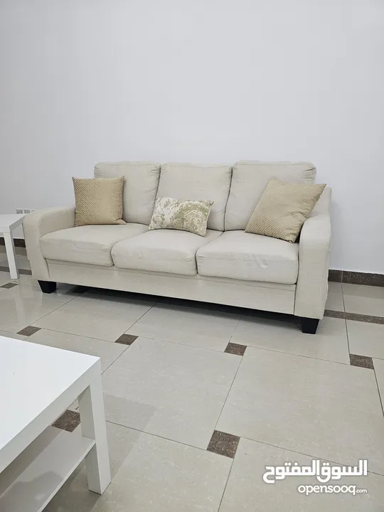 3 seated couch with tables