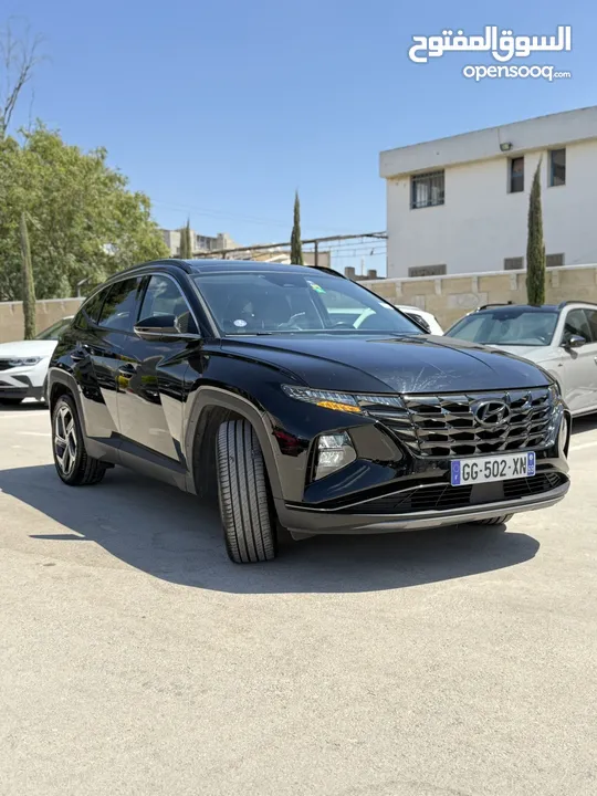 هونداي توسان ترخيص 2022 محرك 1600 هايبرد plug in/يقطع على الشحنه 65 كيلو متر