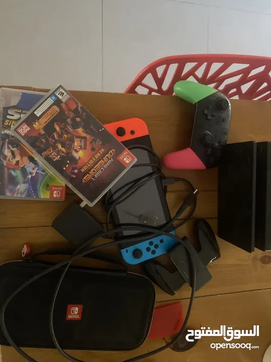 Nintendo switch pack with 2 games,a charger,a controller,and hdmi,and a case,and the nintendo