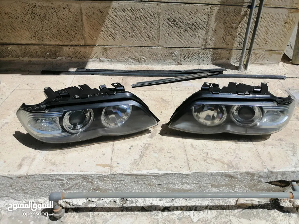 اضوية سيارة BMW x5+ كراسي خلفي جلد طبيعي اصلي اسود + اقزوزت خلفي عدد2 x5 2006