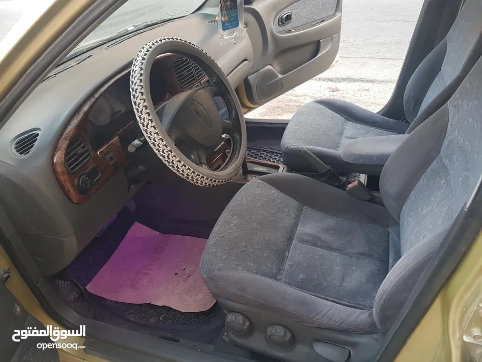 كيا سبكتر توماتيك اقساط دفعة 1200 دهان جديد  ماتور جديد  قير جيد  فحص مرفق  مكانيك سيارة مشية ناعمة