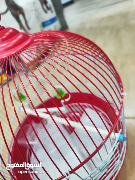 قفص الطيور الدائري الأحمر المميز  مناسب لطيور الحب والروز و الفيشر و الجنة