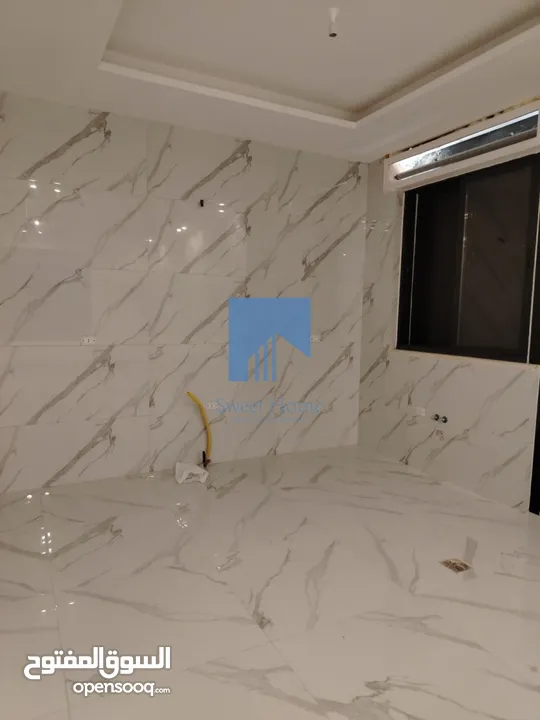 شقة أرضية فاخرة للبيع في خلدا - قرب إشارة البنك العربي 145م مع حديقة وترسات 120م لم تسكن