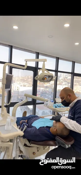 زراعة وتجميل الاسنان في جنين مركز د. اسامة عواد -برج الساعة ط4