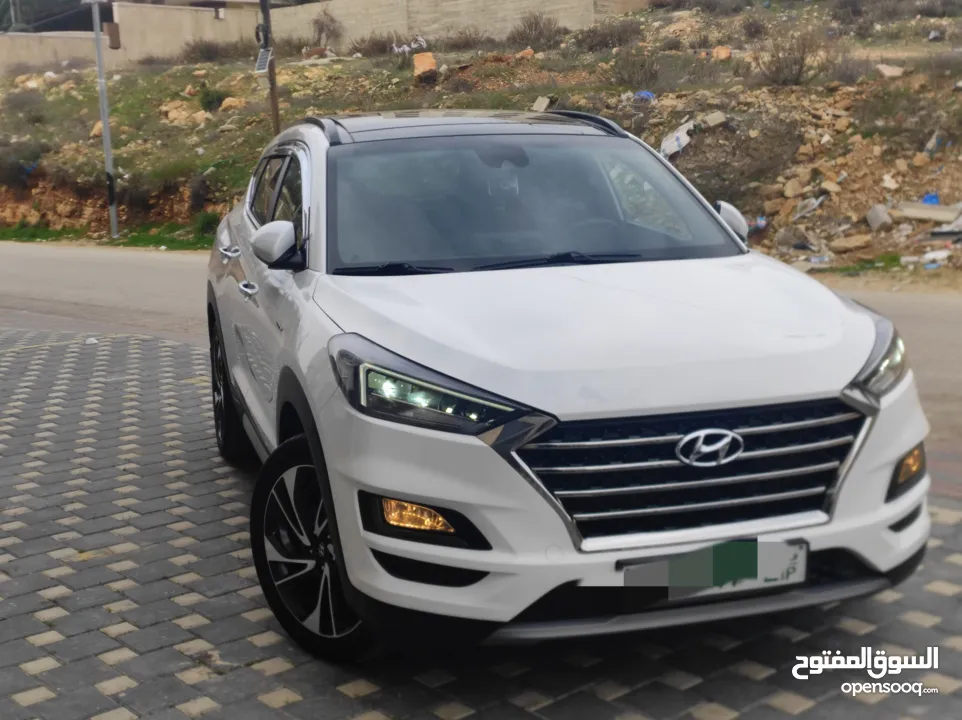 هونداي توسان فل الفل اضافات دهان شركة وعداد أصلي 70000كم فقططط رخصة وتأمين شامل للبيع بسعر مغري