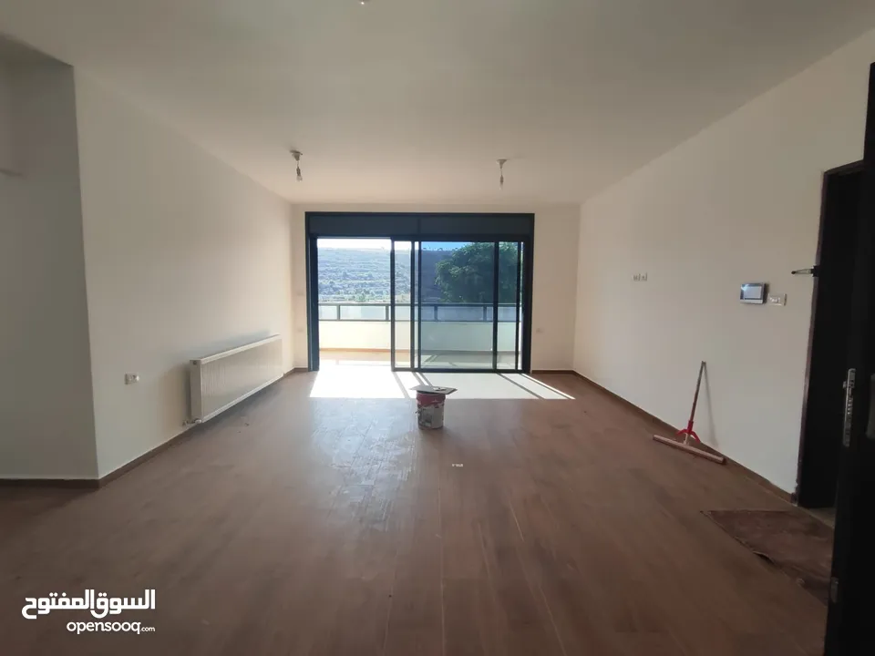 شقة مميزة قيد الفرش للإيجار – عين منجد  شارع إسكان المهندسين