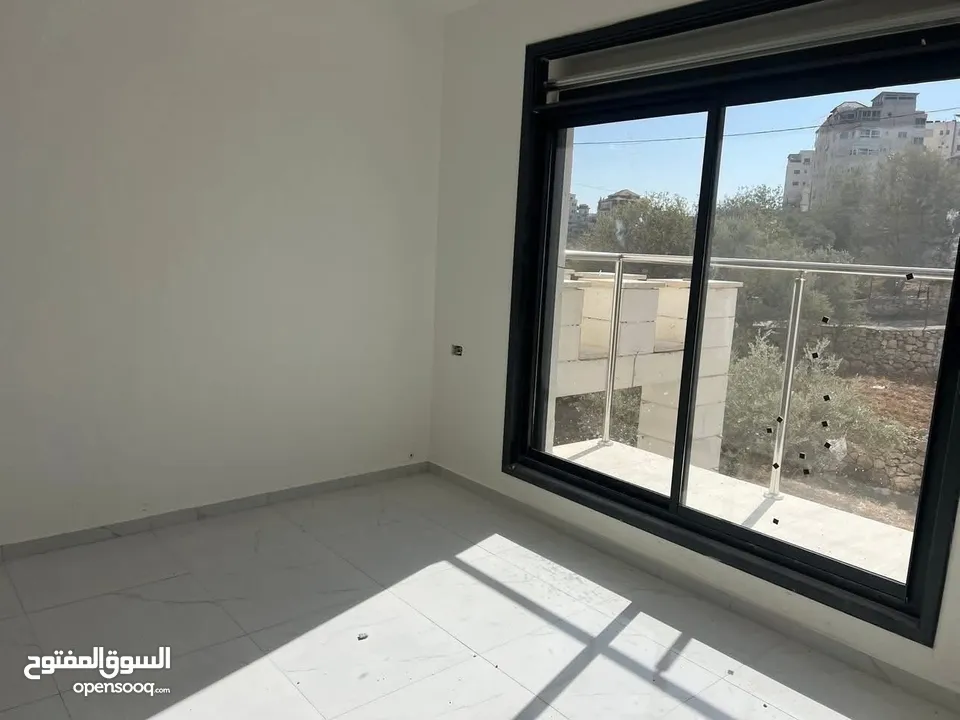 شقه فارغة للايجار في عبن منجد قرب سوبرماركت بغداد لم تسكن من قبل