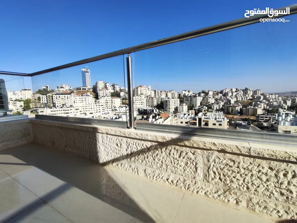 شقة بإطلالة عالية في قلب عين منجد – فرصة لا تعوّض