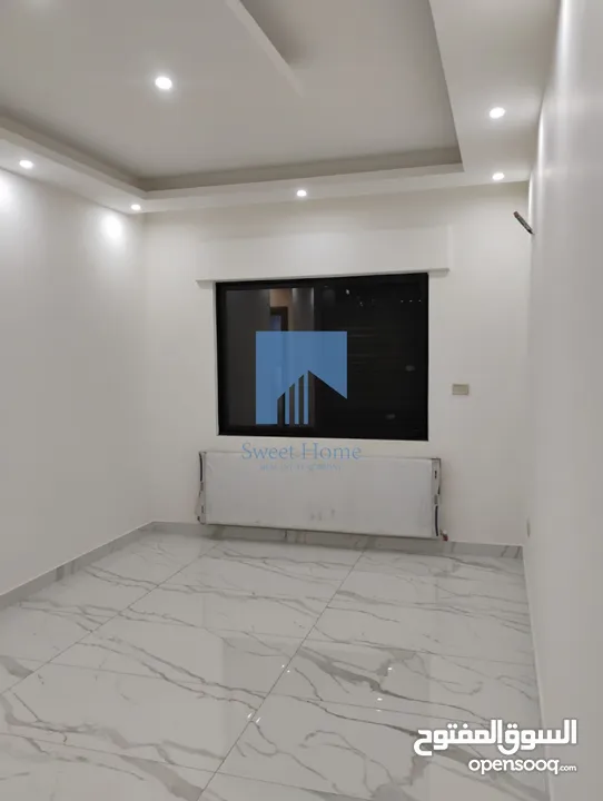 شقة أرضية فاخرة للبيع في الجاردنز  - خلف الدستور 155م مع ترس 25م تشطيب سوبر ديلوكس لم تسكن
