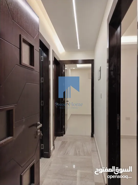 شقة أرضية فاخرة للبيع في خلدا - قرب إشارة الدر المنثور 140م مع حديقة وترسات 70م لم تسكن