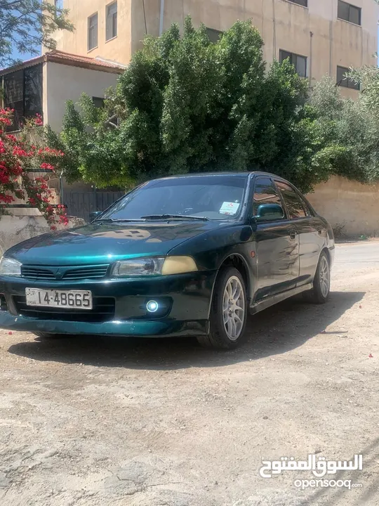 متسوبيشي لانسر 1997 موجوده في جرش في مجال للتفاوض بشي بسيط
