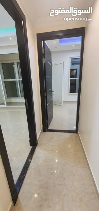 Unfurnished two-room VIP apartment in Al Rawda 3 in Ajman, 2 bathrooms, with a balcony